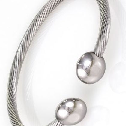 A silver bracelet with two balls on it.