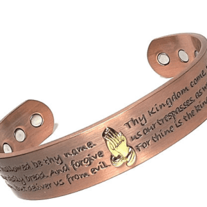 A copper bracelet with the words " thy kingdom come ".