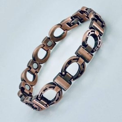 A bracelet that is made of copper.