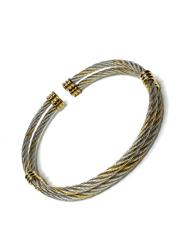 A pair of silver and gold bracelets.