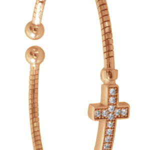 A gold bracelet with a cross on it