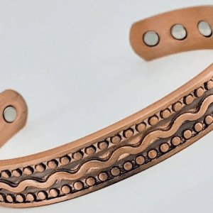 A close up of the side of a copper bracelet