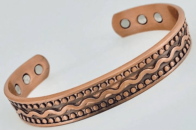 A close up of the side of a copper bracelet