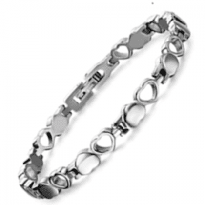 A silver bracelet with hearts and circles on it.