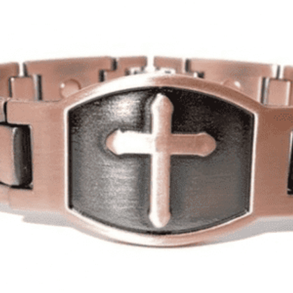 A close up of the cross on a bracelet