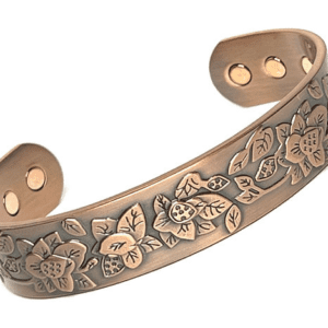 A copper bracelet with flowers and leaves on it.