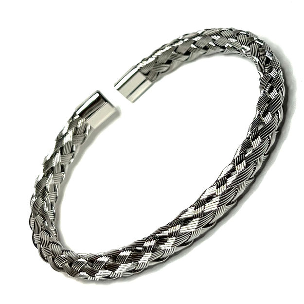 A silver bracelet with two strands of braided leather.