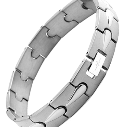 A silver bracelet with a puzzle pattern on it.